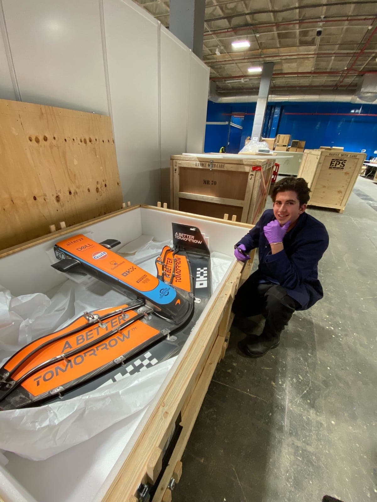 Louis with a McLaren front wing in its shipping crate