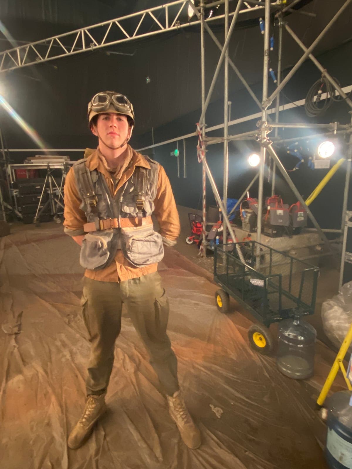 Louis in a 1940s pilot costume on a film set