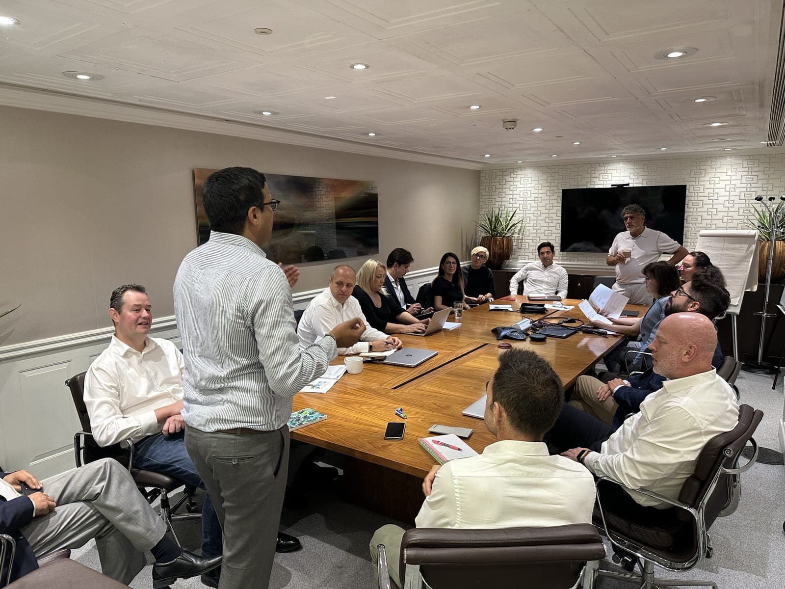 A full table at an investment meeting
