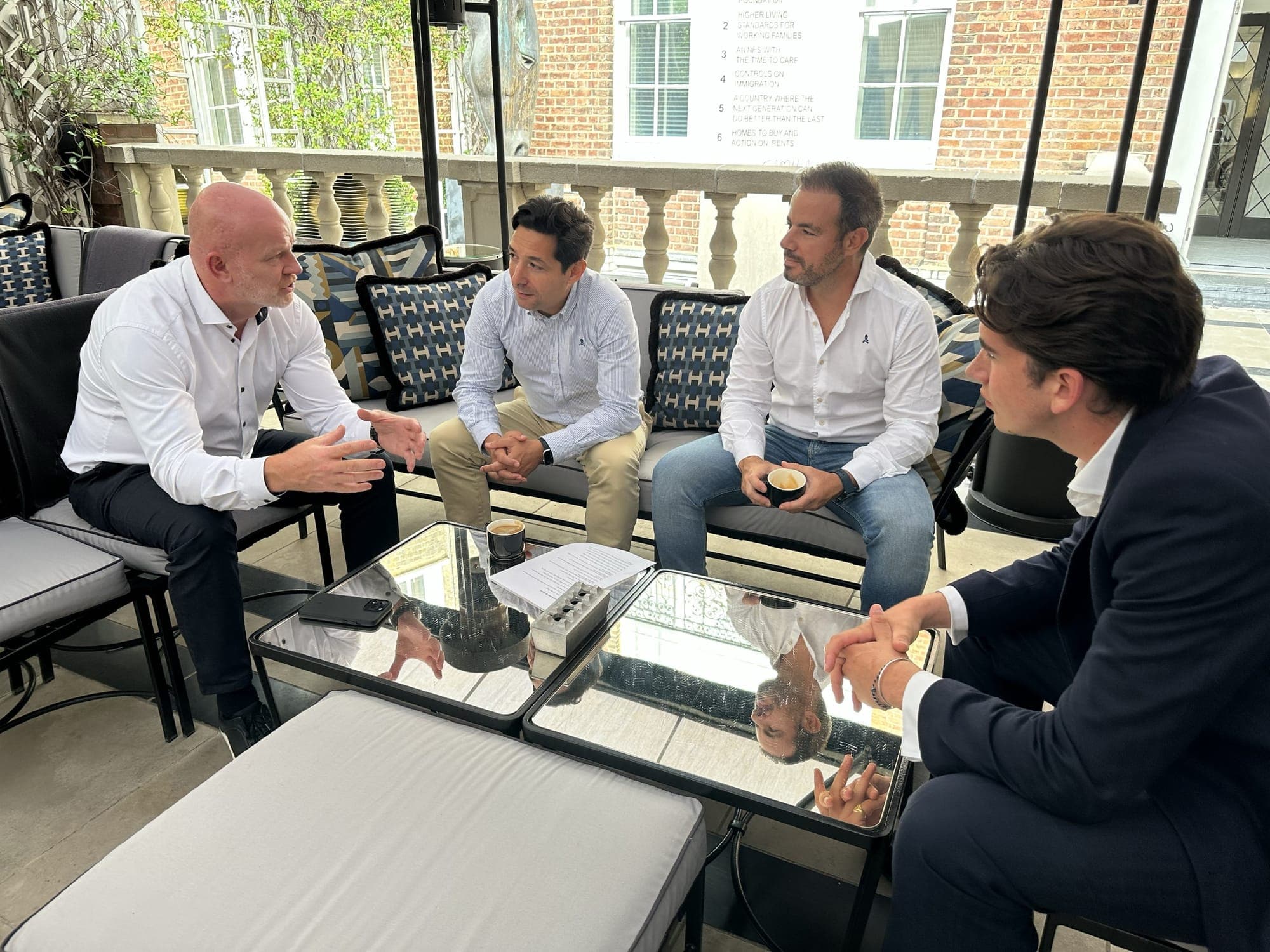 A joint venture meeting on a Mayfair terrace